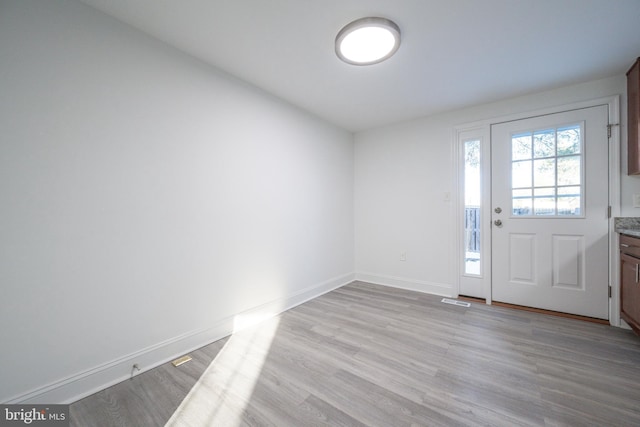 foyer entrance featuring light hardwood / wood-style flooring