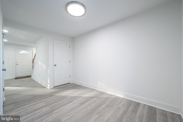 spare room with light wood-type flooring