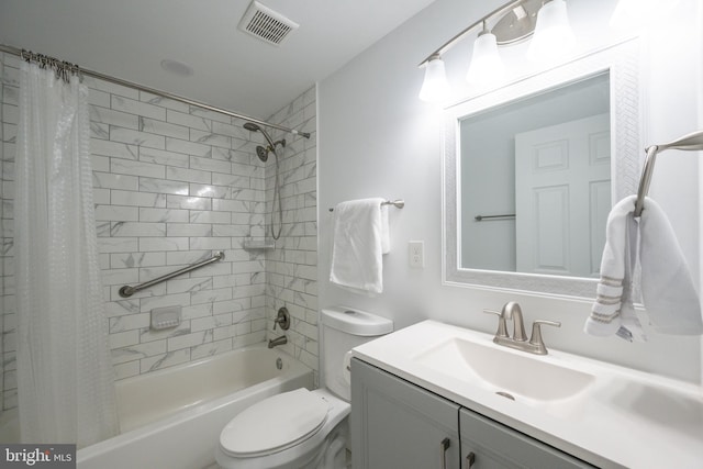 full bathroom with vanity, shower / bath combo, and toilet