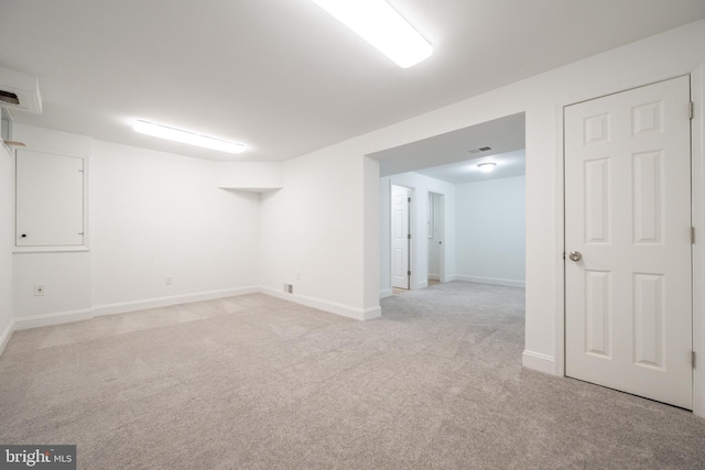 basement with light colored carpet