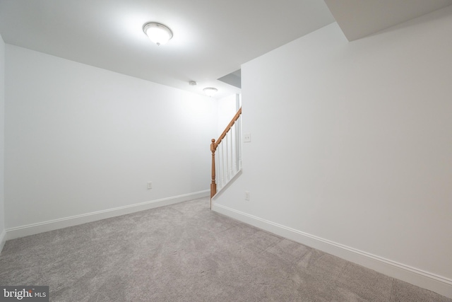 unfurnished room with light carpet