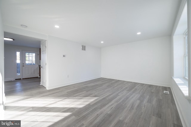 empty room with hardwood / wood-style flooring