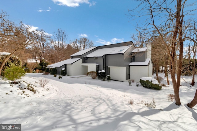 view of snow covered house