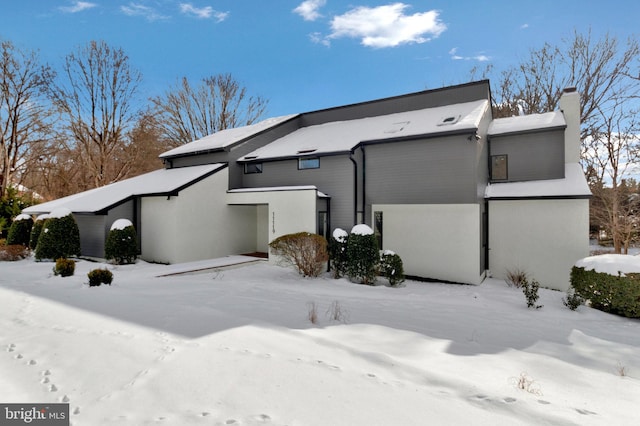 view of snow covered house