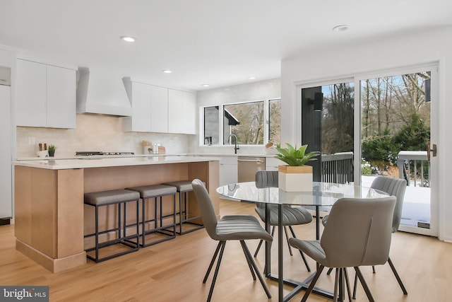 dining area featuring light wood-type flooring