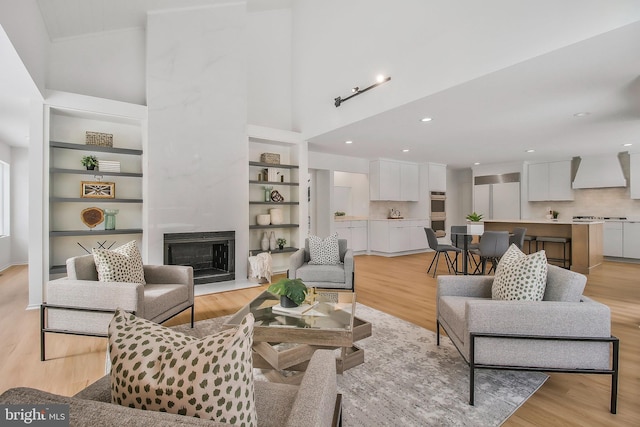 living room featuring a fireplace and light hardwood / wood-style flooring