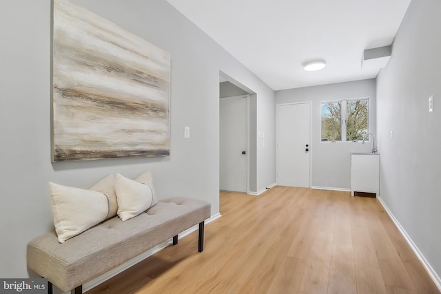 sitting room featuring light hardwood / wood-style floors