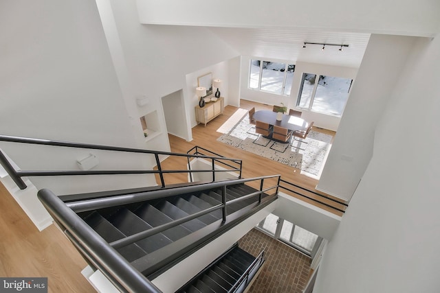 stairs with hardwood / wood-style floors