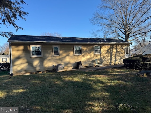 view of property exterior with a yard