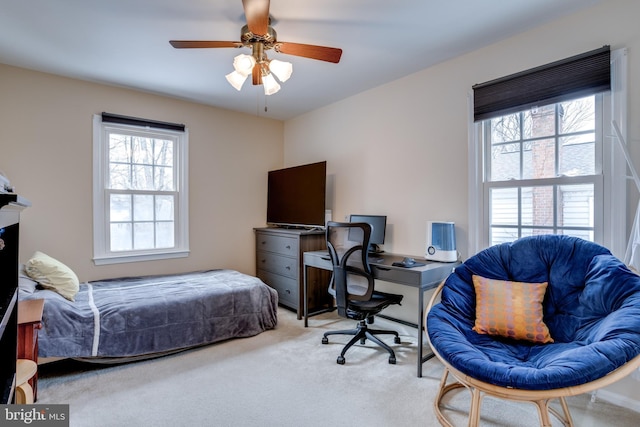 bedroom with ceiling fan and carpet