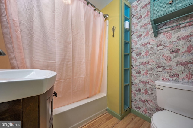 bathroom with toilet, shower / bathtub combination with curtain, built in features, and hardwood / wood-style flooring