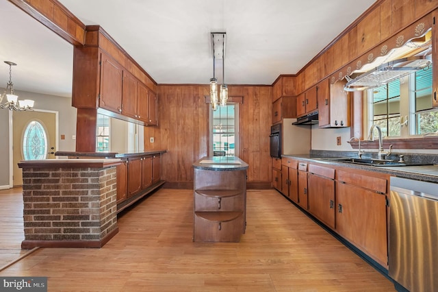 kitchen featuring a wealth of natural light, dishwasher, a kitchen island, and pendant lighting