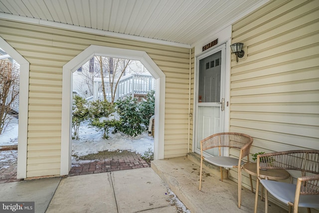 view of snow covered property entrance