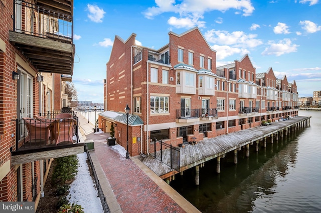 exterior space with a water view and central air condition unit