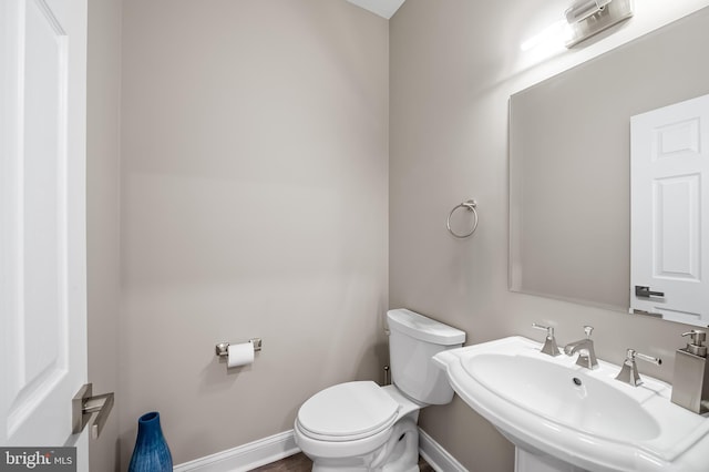 bathroom with sink and toilet