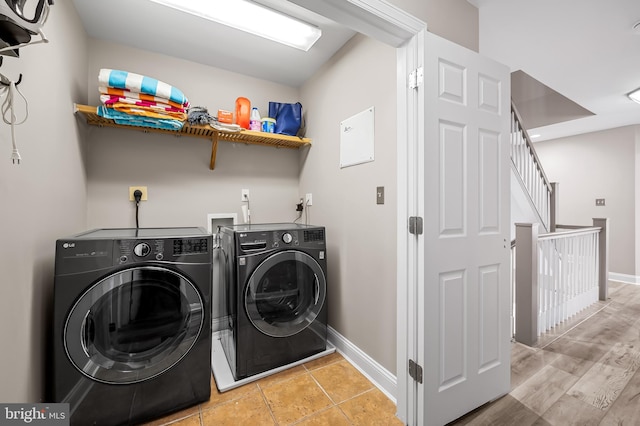 washroom featuring washer and clothes dryer