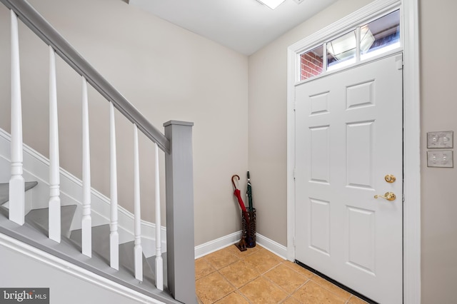 entrance foyer with light tile patterned floors