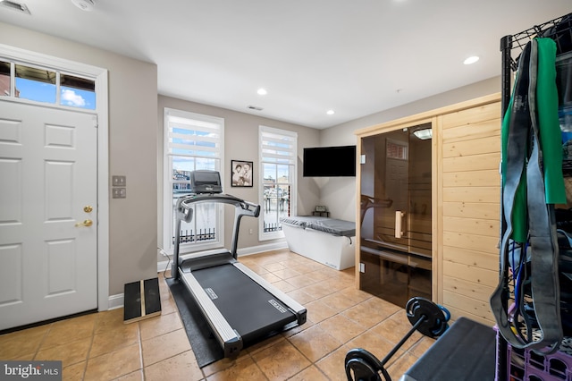 exercise area featuring tile patterned flooring