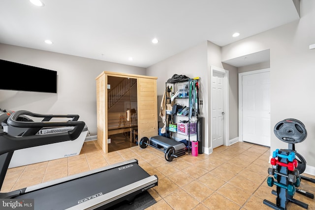 workout area featuring light tile patterned floors