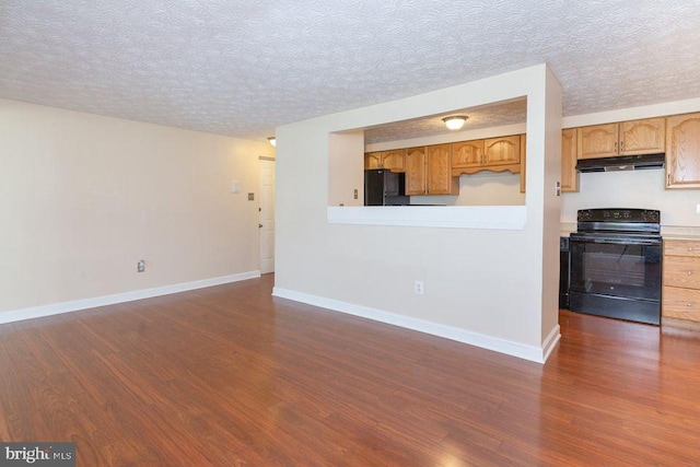 unfurnished living room with a textured ceiling and dark wood-type flooring