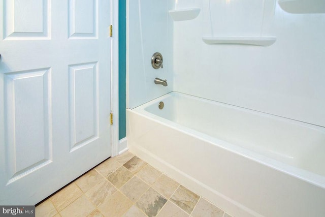 bathroom with shower / washtub combination