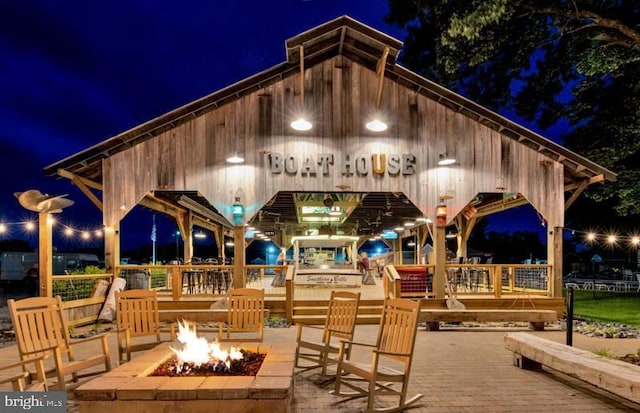 patio at night with a fire pit