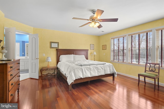 bedroom featuring ceiling fan and dark hardwood / wood-style floors