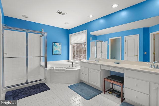 bathroom featuring vanity, independent shower and bath, and tile patterned flooring