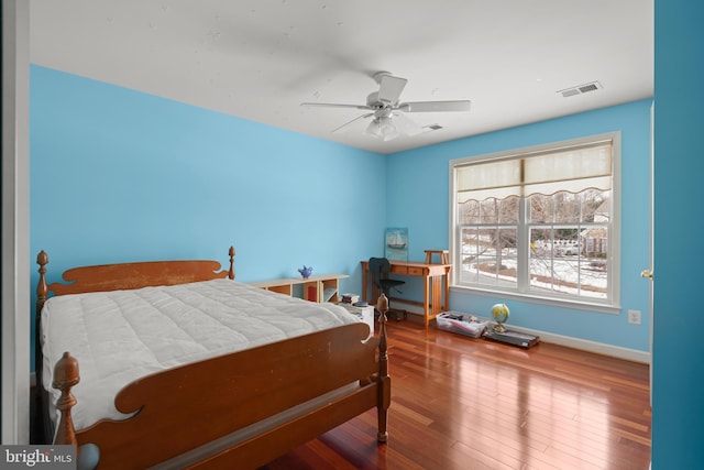 bedroom featuring hardwood / wood-style floors and ceiling fan