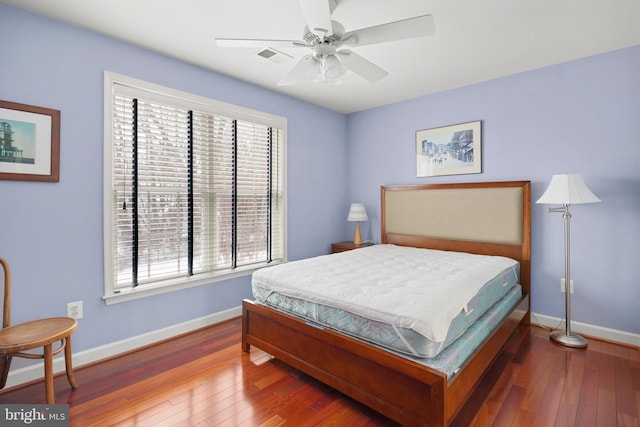 bedroom with hardwood / wood-style floors and ceiling fan