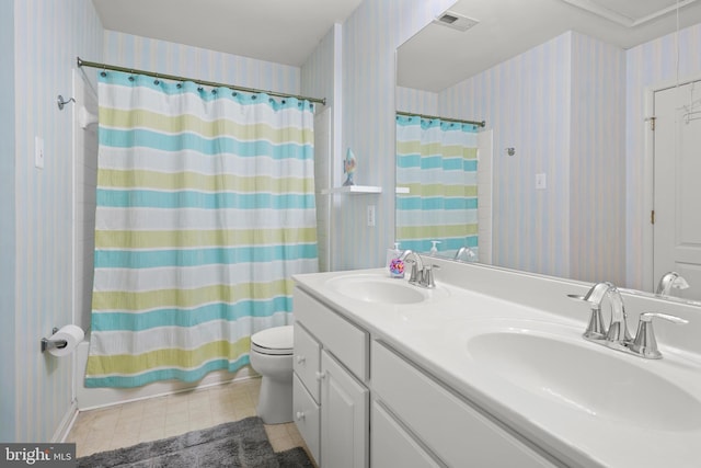 bathroom with toilet, vanity, and walk in shower