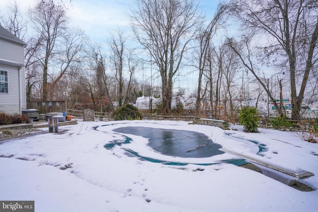 view of yard layered in snow