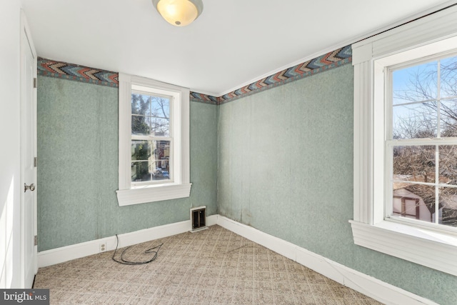 spare room featuring plenty of natural light