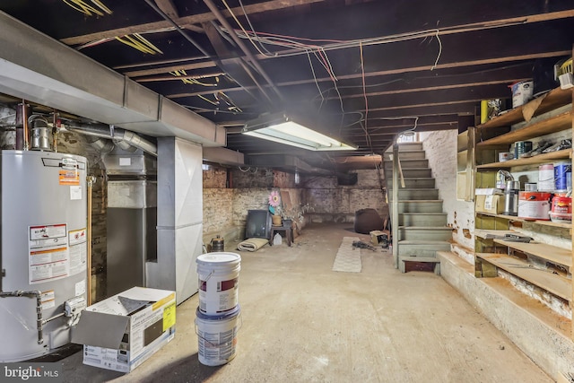 basement featuring heating unit and water heater