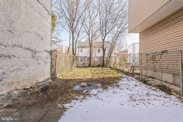 view of yard covered in snow