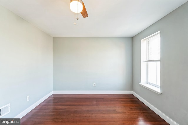 unfurnished room featuring ceiling fan and dark hardwood / wood-style flooring