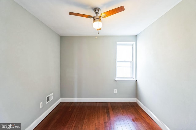 unfurnished room with ceiling fan and dark hardwood / wood-style flooring