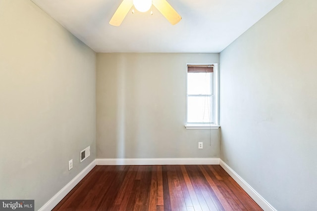 spare room featuring ceiling fan and dark hardwood / wood-style flooring