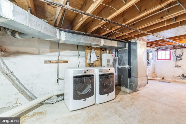 basement with heating unit and washer and dryer