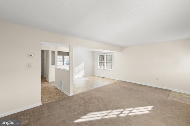 spare room with light colored carpet