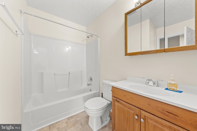 full bathroom with bathtub / shower combination, a textured ceiling, vanity, and toilet