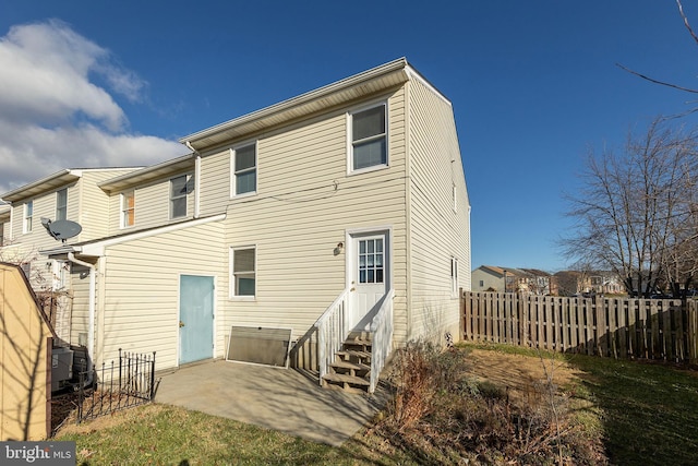 back of property with a patio