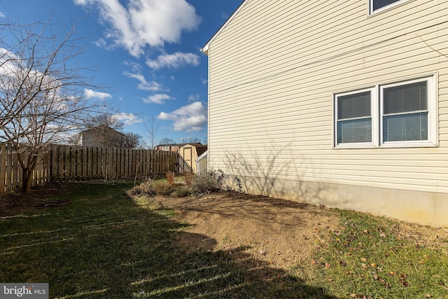 view of side of home featuring a yard