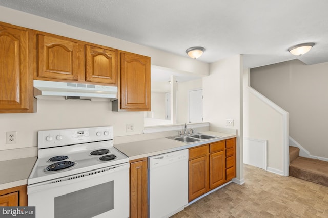 kitchen with white appliances and sink