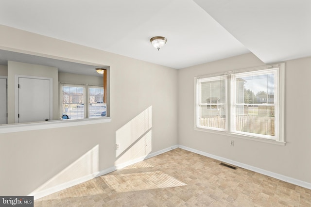 unfurnished room with plenty of natural light