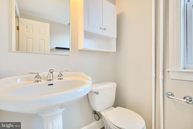 bathroom with sink and toilet