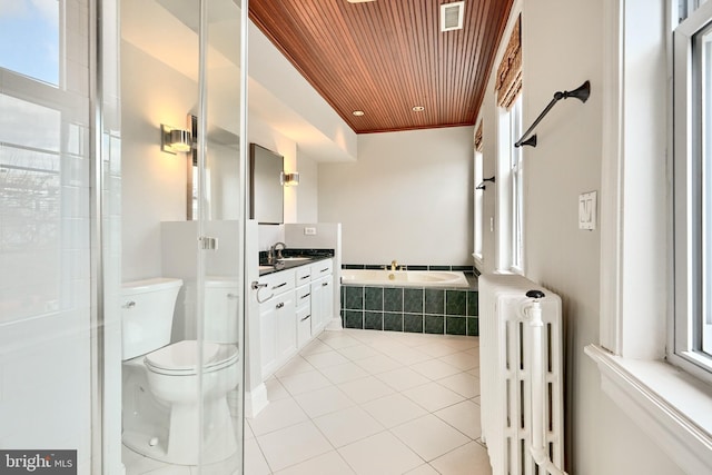 bathroom with radiator, tiled bath, toilet, vanity, and wood ceiling