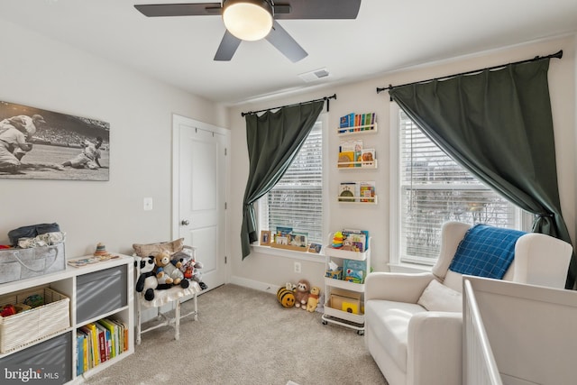 recreation room featuring ceiling fan and light carpet