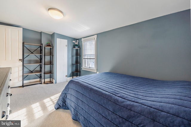 bedroom with light colored carpet