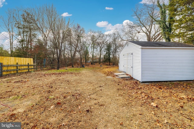 view of yard with a storage unit